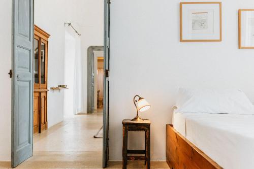Ένα ή περισσότερα κρεβάτια σε δωμάτιο στο Masseria Li Foggi