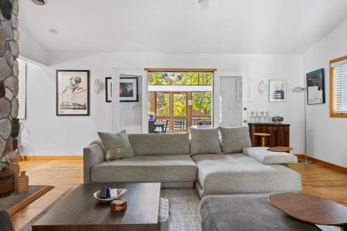 a living room with a couch and a table at Casa Azur in Union Pier