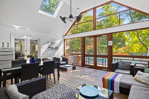 a living room filled with furniture and a large window at Casa Azur in Union Pier