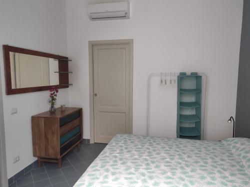 Postel nebo postele na pokoji v ubytování Appartamento con giardino e vista panoramica