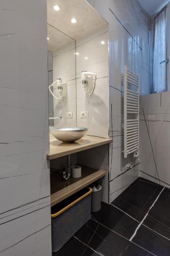 a bathroom with a sink and a mirror at Villa Vitali - Bellagio in Bellagio