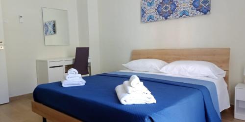 Un pat sau paturi într-o cameră la Samar 2