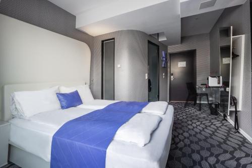 Postel nebo postele na pokoji v ubytování Magic Hotel & Apartments Kløverhuset