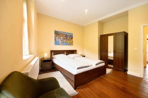 En eller flere senge i et værelse på Alte Stadtvilla am Weinberg 3