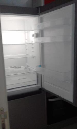 an empty refrigerator with its door open in a kitchen at Kariat Cabo resort in M'diq