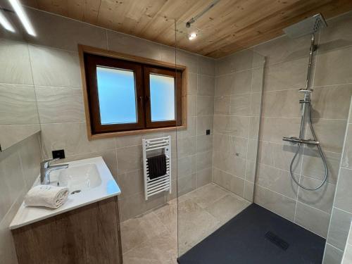 a bathroom with a sink and a shower at Chalet l'Abériot in Montriond