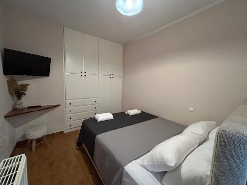 Ένα ή περισσότερα κρεβάτια σε δωμάτιο στο Urban lodge Agios Dimitrios