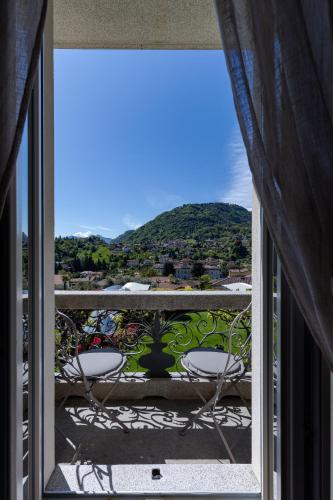 a balcony with a view of a mountain at Villa Vitali - Bellagio in Bellagio