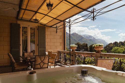 a hot tub on the balcony of a house at Villa Vitali - Bellagio in Bellagio