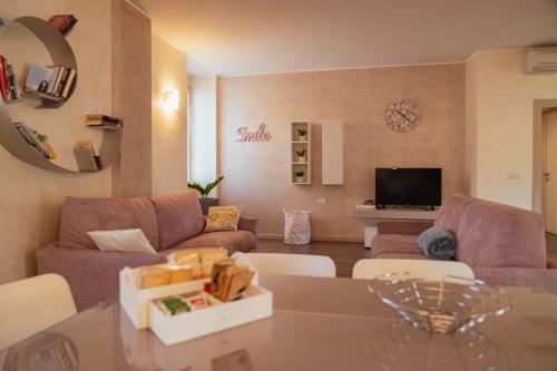a living room with a couch and a table at Villa Vitali - Bellagio in Bellagio