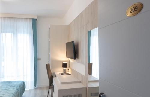 Televisyen dan/atau pusat hiburan di Hotel & Aparthotel Carinthia S