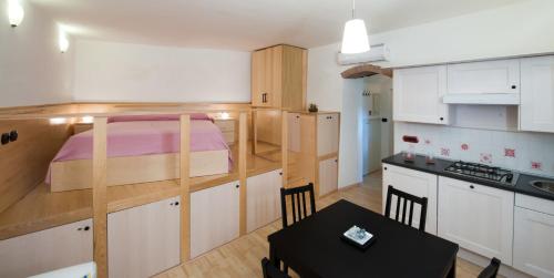 Kuchyňa alebo kuchynka v ubytovaní La Sentinella Holiday House
