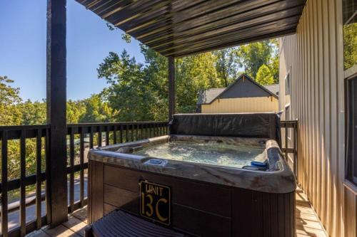a hot tub on the deck of a house at Briarstone Lodge Condo 13C in Pigeon Forge
