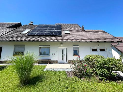 a house with solar panels on the roof at Arnlod's nest in Kotlje