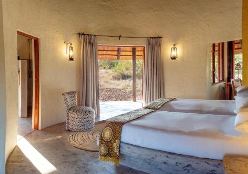 Katil atau katil-katil dalam bilik di Motswari African Retreat & Walking Safaris by NEWMARK