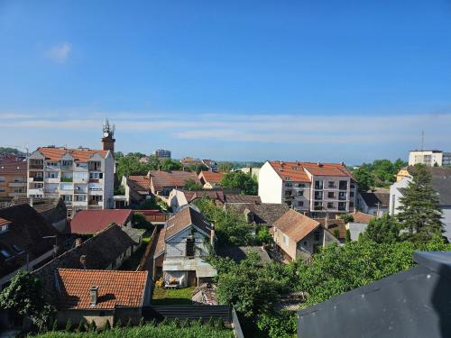 a view of a city with houses and buildings at Apartman Sky in Sremska Mitrovica