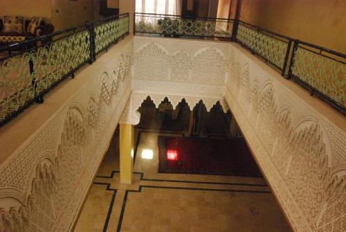 an overhead view of a staircase with white railing at Hotel Taddart in Midelt