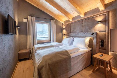 Postel nebo postele na pokoji v ubytování Filzsteinresort Wohnungen Top 5