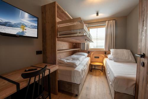 Ένα ή περισσότερα κρεβάτια σε δωμάτιο στο Filzsteinresort Wohnungen Top 4