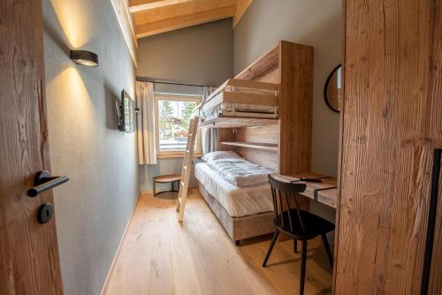 Ένα ή περισσότερα κρεβάτια σε δωμάτιο στο Filzsteinresort Wohnungen Top 12