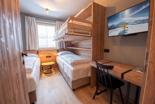 Postel nebo postele na pokoji v ubytování Filzsteinresort Wohnungen Top 9