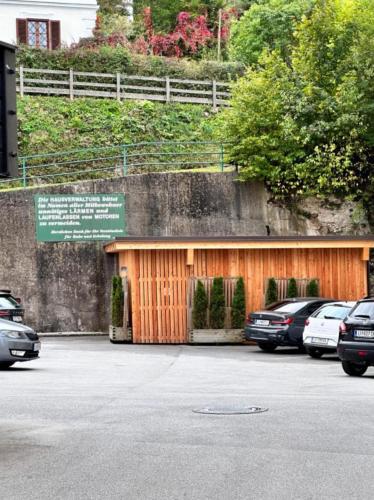 a garage with cars parked in a parking lot at Ferienwohnung AltePost in Bad Aussee
