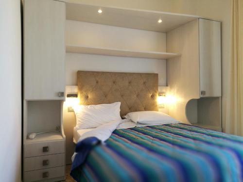 Postel nebo postele na pokoji v ubytování Hotel Confort