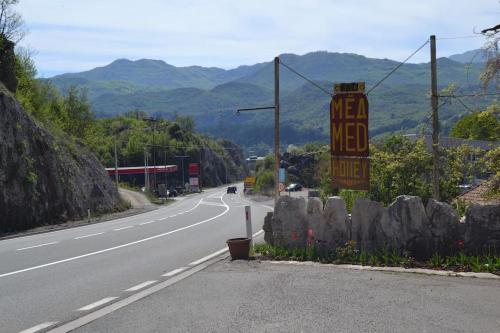 a road with a sign that reads new mexico at Una Apartment Cetinje in Cetinje
