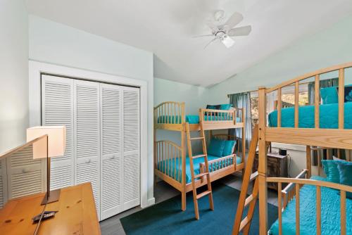 a room with two bunk beds and a desk at Nan's Escape in Union Pier