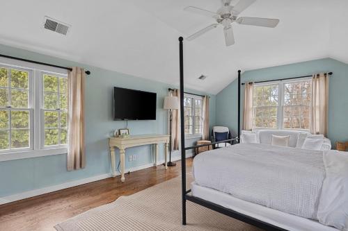 a bedroom with a bed and a flat screen tv at Rabbit Run in Sawyer