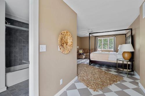 a bedroom with a bed and a bathroom at Rabbit Run in Sawyer