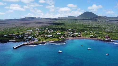an aerial view of a small island with boats in the water at El Pajas in Puerto Velasco Ibarra