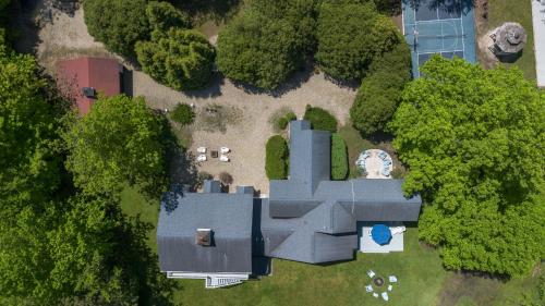 an aerial view of a house with trees at Rabbit Run in Sawyer