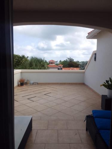 a view of a large patio with a building in the background at Hotel La Vista Azul in Turtle Cove
