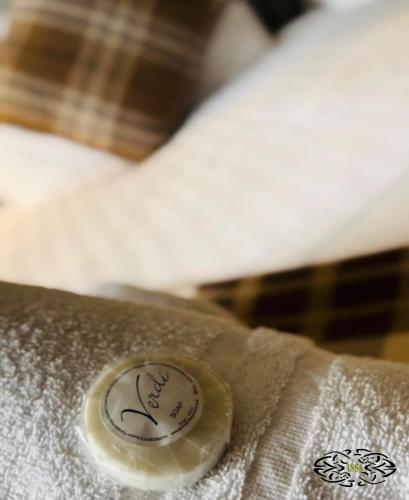 a close up of a button on a bed at Royal Marine Hotel Dunoon in Kirn