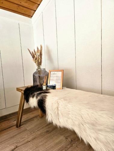 a table with a black and white rug on it at Haus Marinus in Jerzens