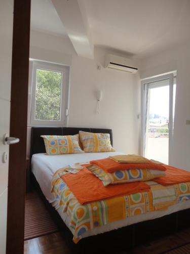 Ένα ή περισσότερα κρεβάτια σε δωμάτιο στο Apartments Bellevue - Otasevic