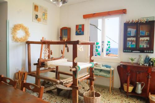 a room with a sewing machine and a window at Atlantis in Samos