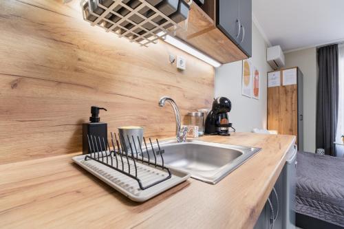 a kitchen with a sink and a counter top at City Center Studio Apartments in Plovdiv