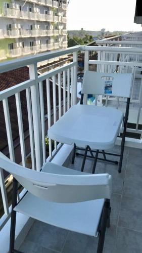 two chairs and a table on a balcony at VP - Amani Grand Resort Residences, 03 Minutes Away From Mactan Airport - Bldg B - Unit 522 in Pusok