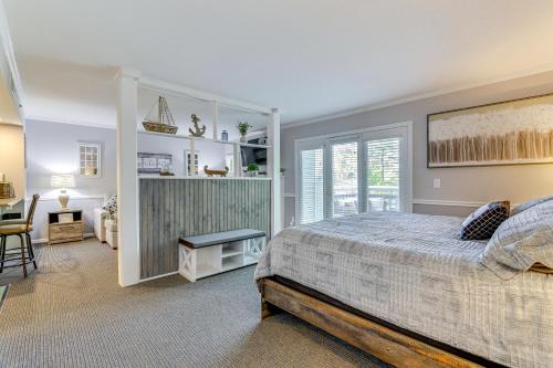 a bedroom with a bed and a desk and a chair at Norwich Vacation Rental with Golf Course Views! in Norwich