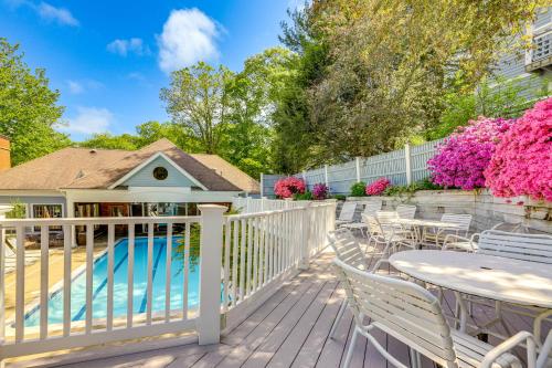 a deck with a table and chairs next to a pool at Norwich Vacation Rental with Golf Course Views! in Norwich