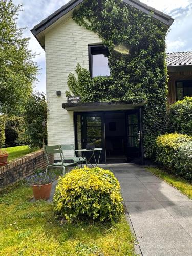 a house with a bench in front of it at La Grange 28 in Bergen op Zoom