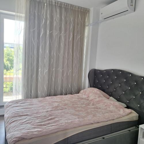 Кровать или кровати в номере Apartament 2 camere