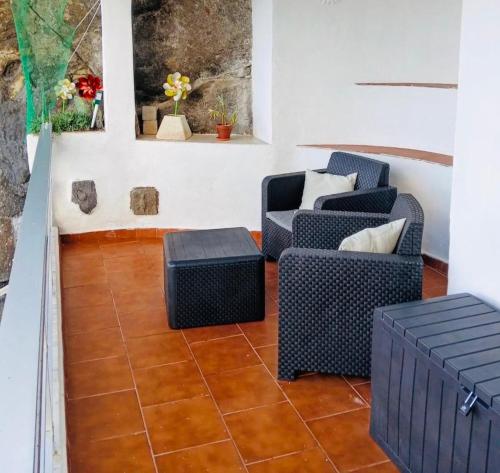 a living room with two chairs and a table at Sea lover's nest in Los Realejos
