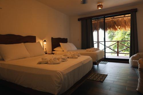 Postel nebo postele na pokoji v ubytování Villas Tucan Bacalar Lagoon Front