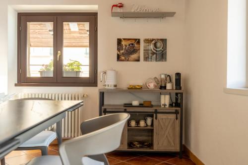 a dining room with a table and two chairs at Apartment Tamara Suite - Menaggio in Menaggio