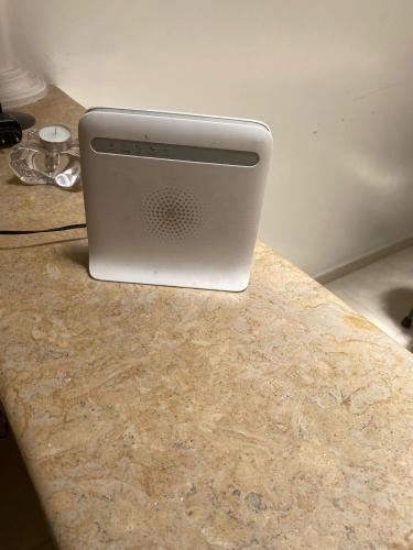 a laptop computer sitting on top of a counter at Riad Nour Resorts-Riad Nour Travel in Marrakech