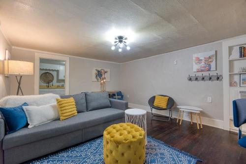 a living room with a couch and a table at #StayinMyDistrict Heritage House Pet Friendly Apartment in Coos Bay