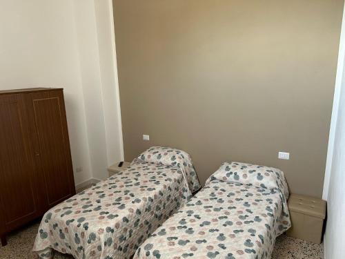 Postel nebo postele na pokoji v ubytování Casa Bel Duomo